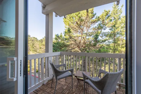 a view of a two chair in the balcony