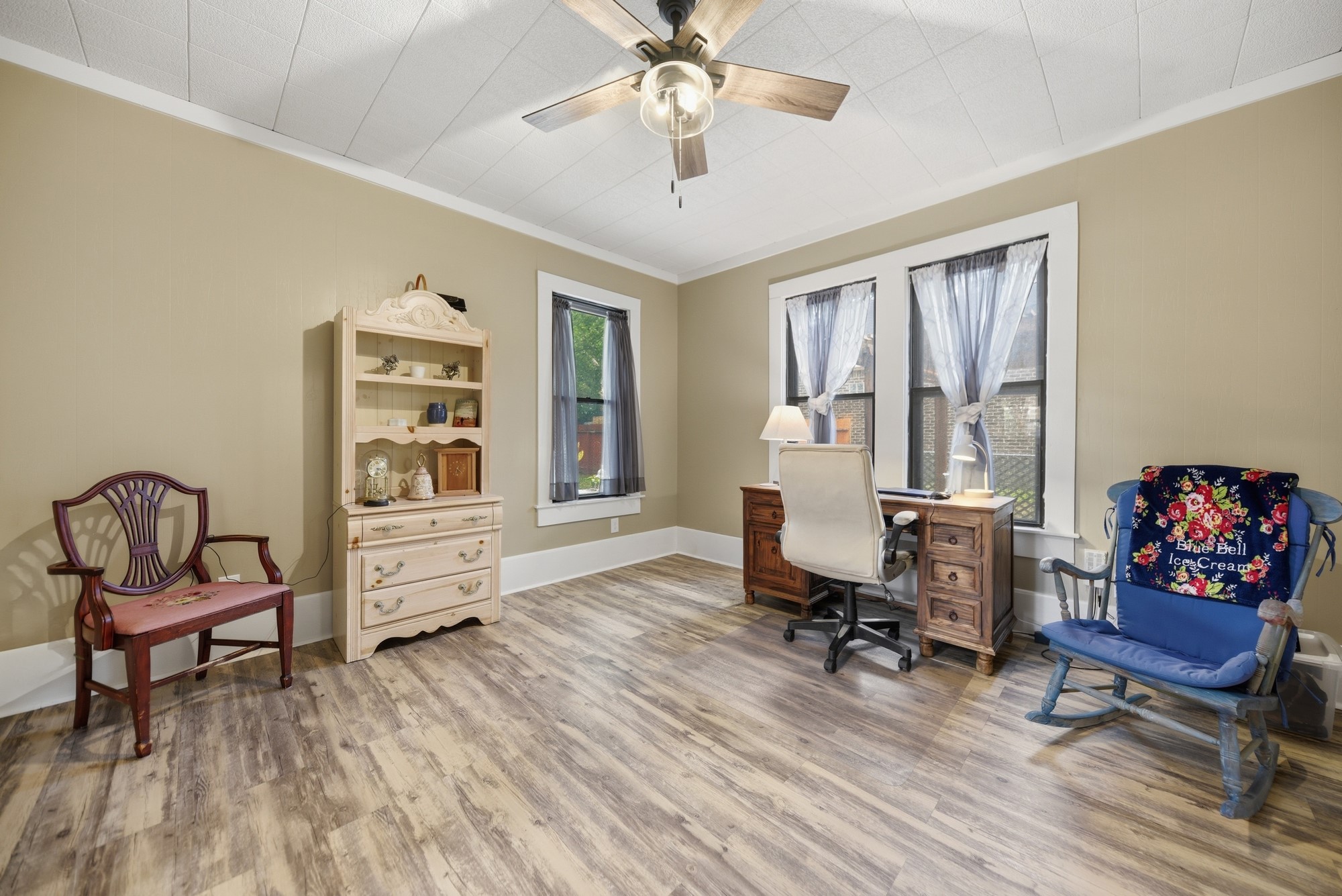 1501 South Austin Street Brenham, TX 77833 - Photo 16 of 36 a view of a workspace with furniture and a window