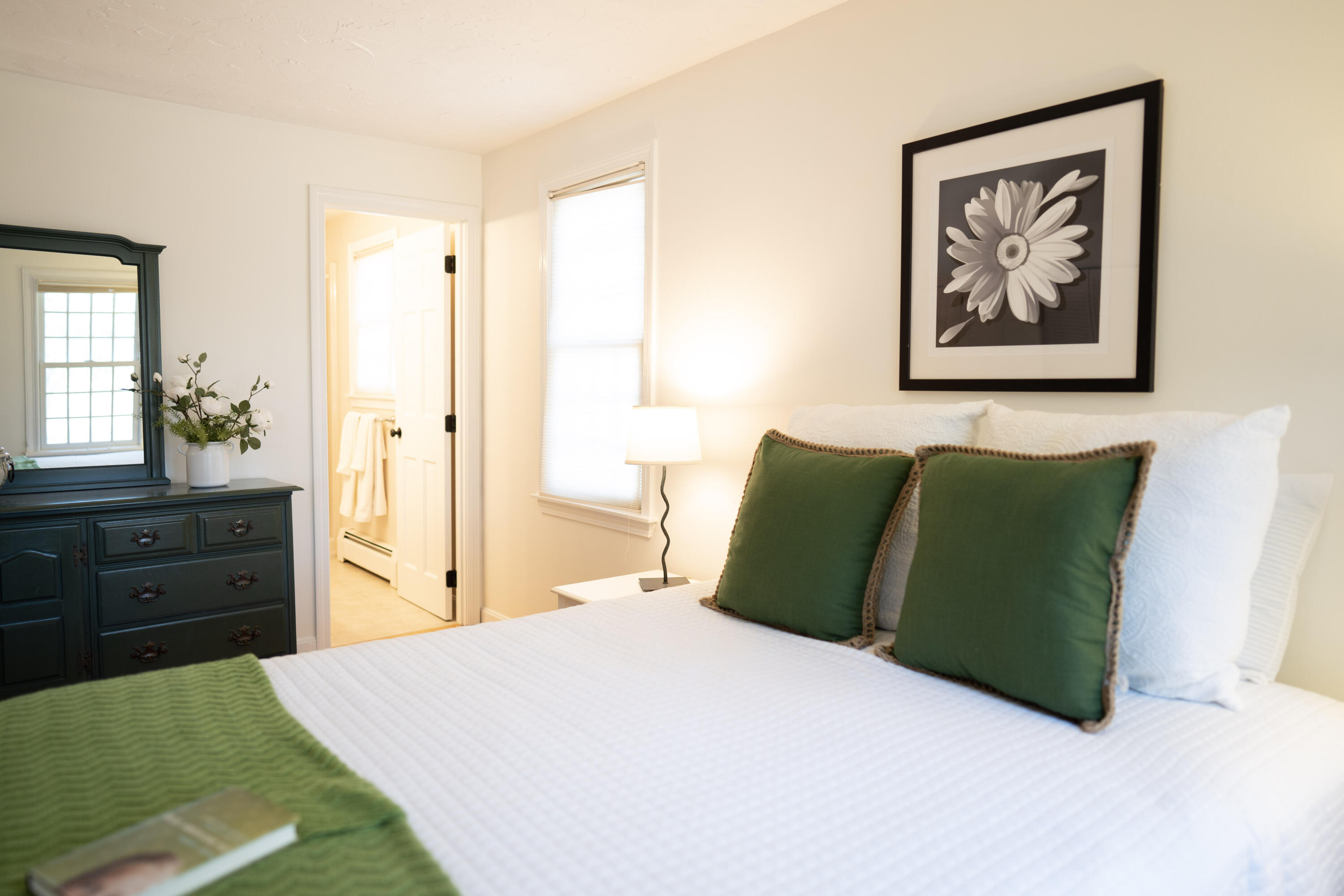 72 Cove Road South Dennis, MA 02660 - Photo 20 of 37 a bedroom with a bed and a painting on the wall