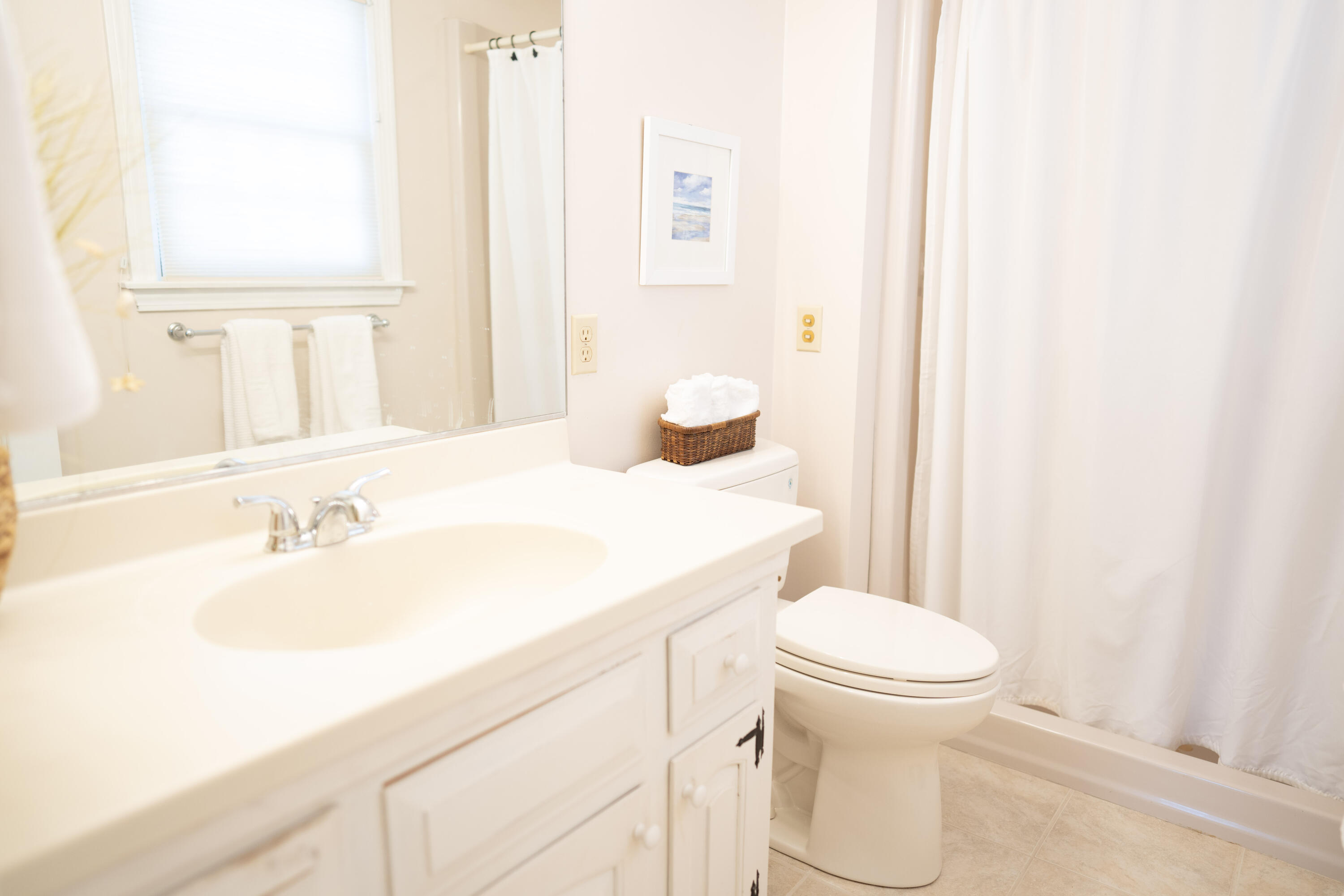 72 Cove Road South Dennis, MA 02660 - Photo 21 of 37 a bathroom with a sink toilet vanity and tub