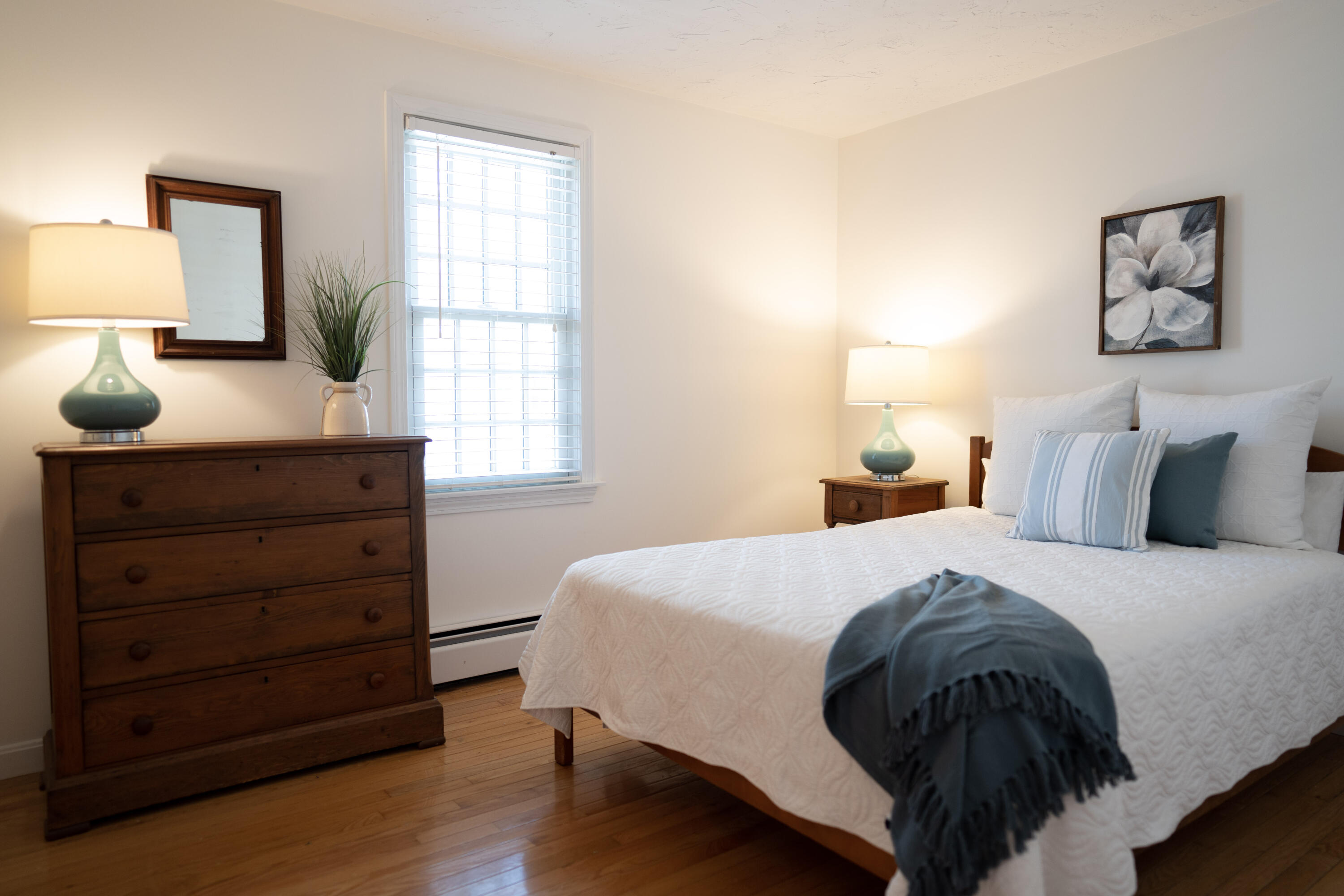 72 Cove Road South Dennis, MA 02660 - Photo 22 of 37 a bedroom with a bed a lamp and window