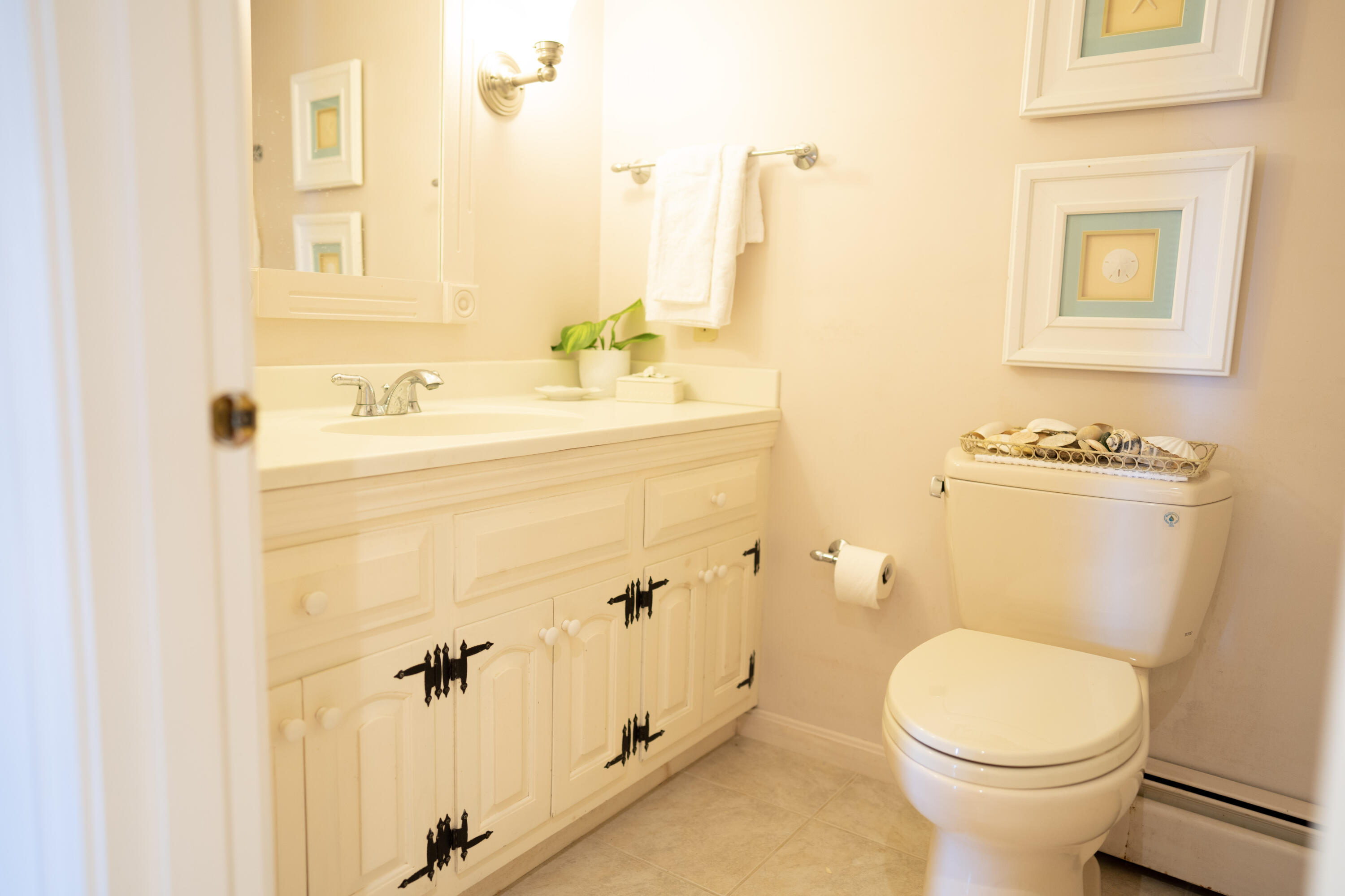 72 Cove Road South Dennis, MA 02660 - Photo 24 of 37 a bathroom with a sink a toilet and a mirror