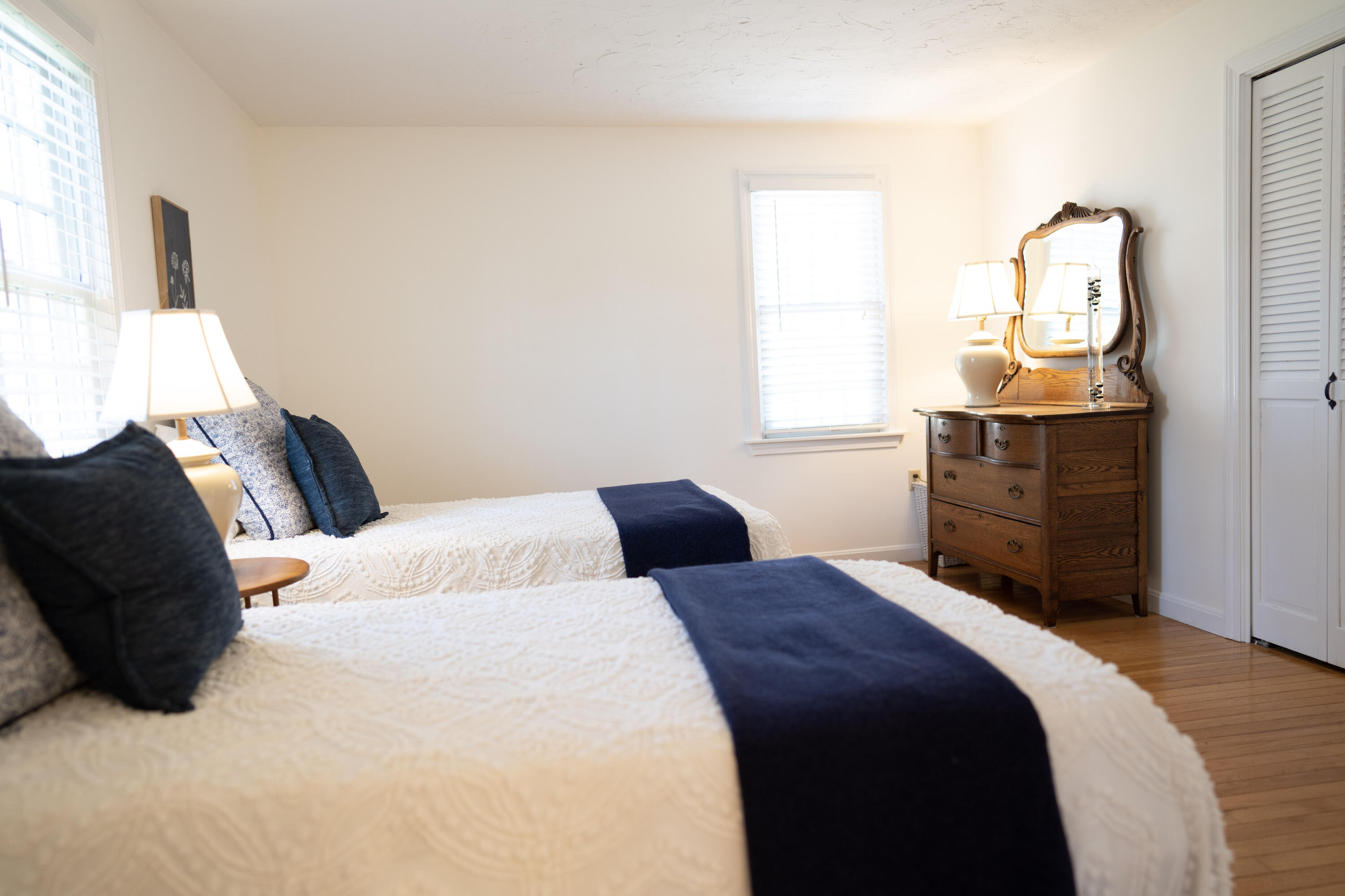 72 Cove Road South Dennis, MA 02660 - Photo 26 of 37 a bedroom with a bed and wooden floor