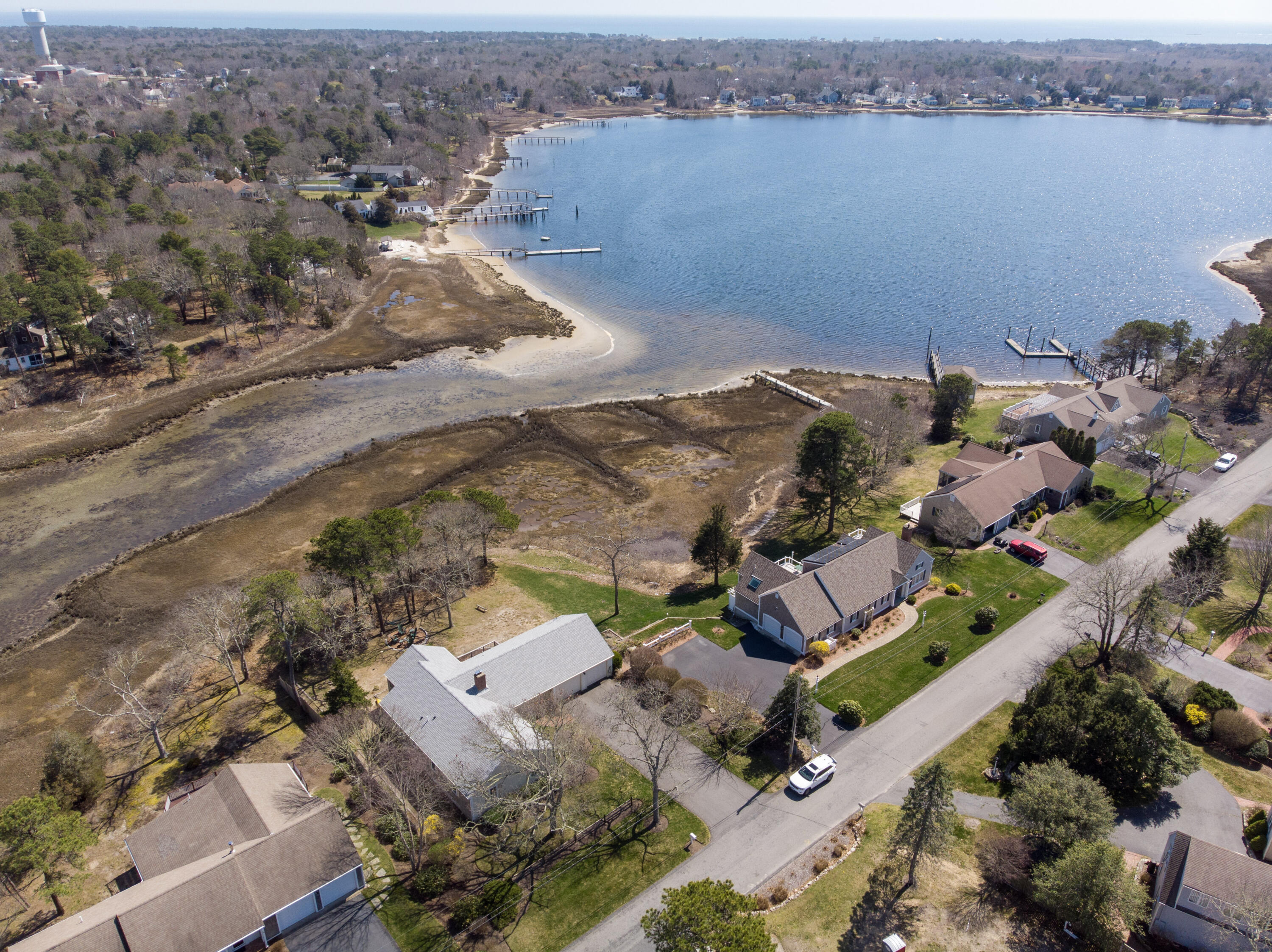 72 Cove Road South Dennis, MA 02660 - Photo 33 of 37 an aerial view of multiple houses with yard