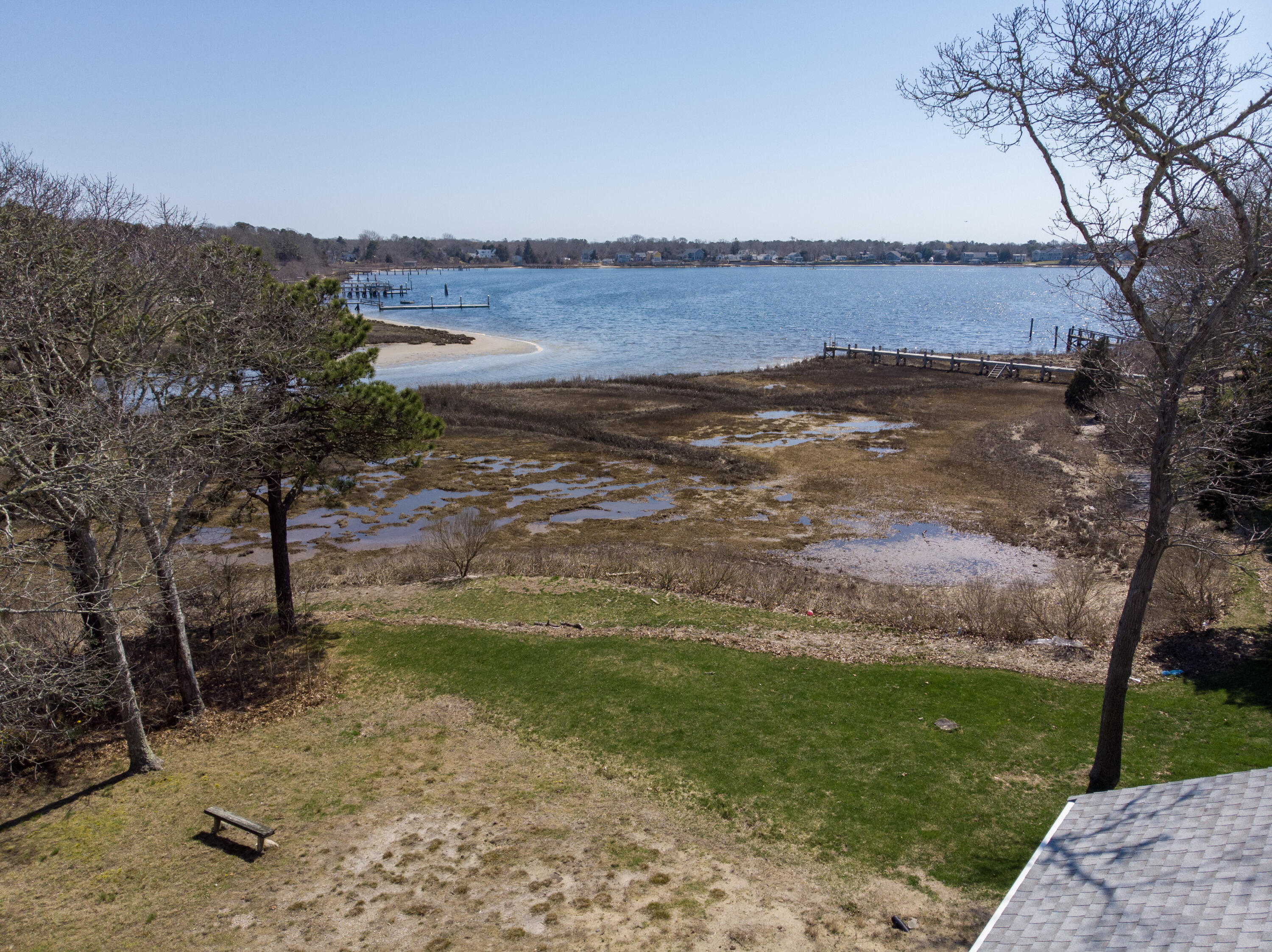 72 Cove Road South Dennis, MA 02660 - Photo 34 of 37 a view of a lake with a yard