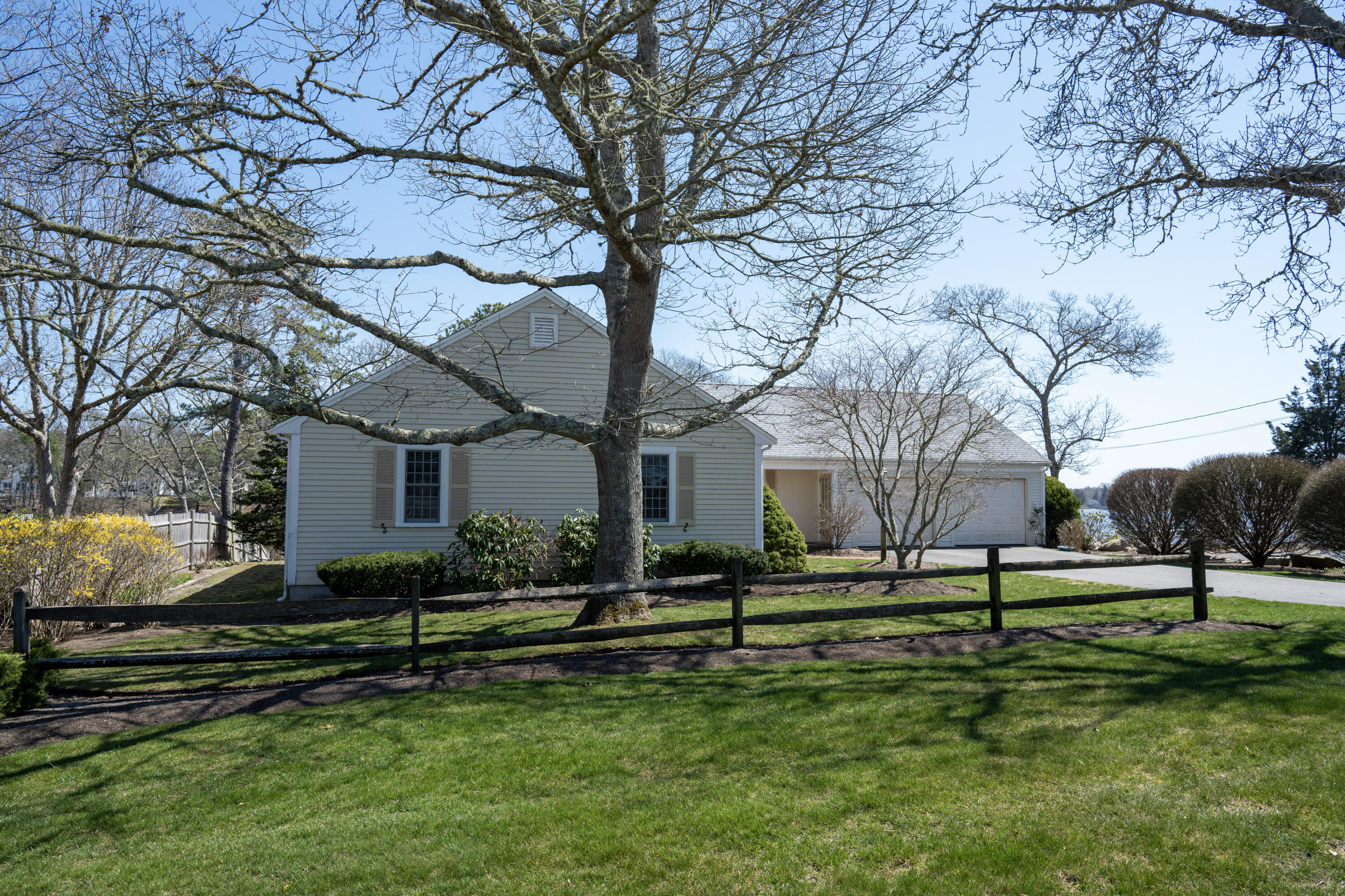 72 Cove Road South Dennis, MA 02660 - Photo 37 of 37 a backyard of a house with lots of green space