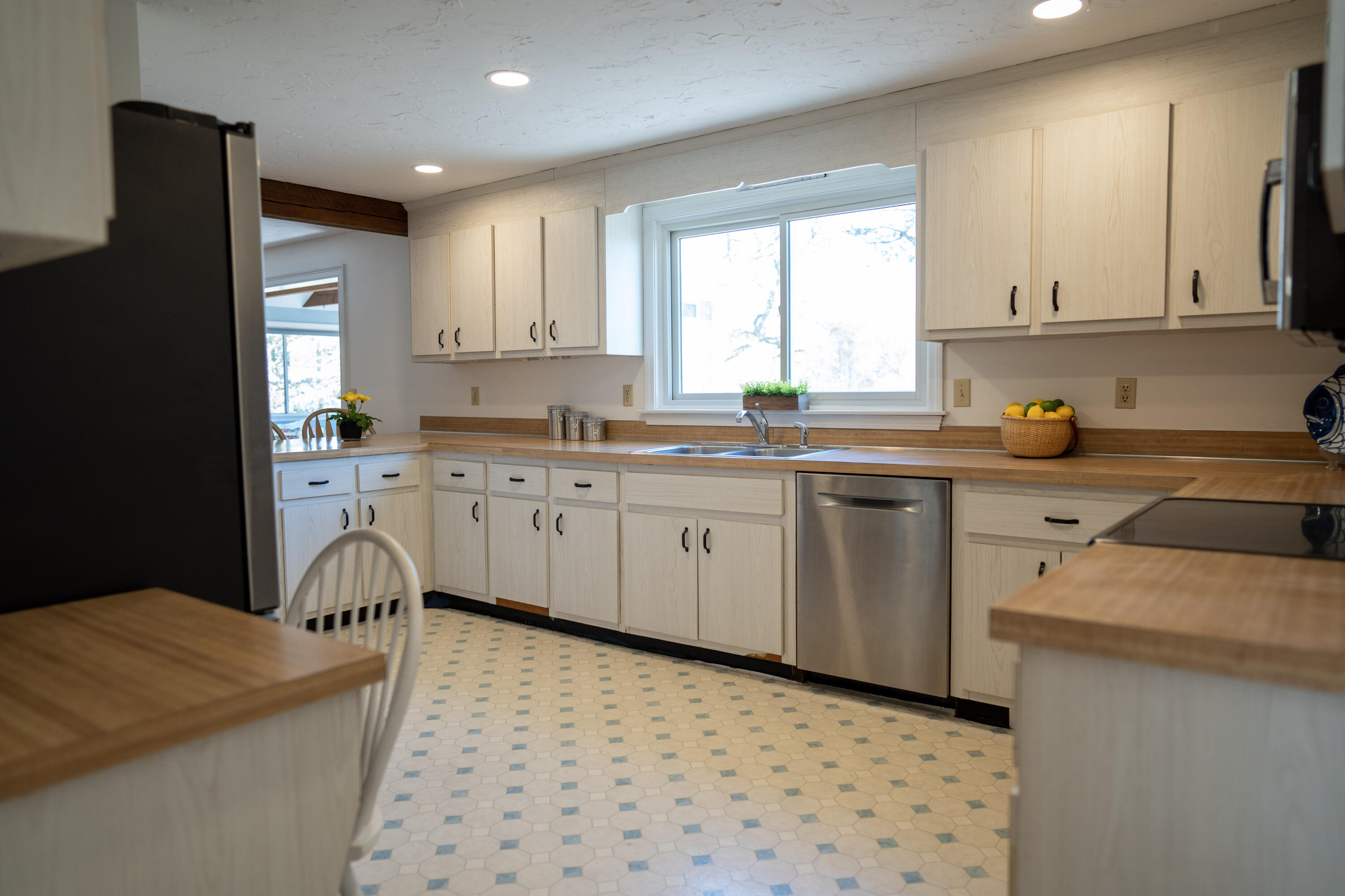 72 Cove Road South Dennis, MA 02660 - Photo 8 of 37 a kitchen with a sink a stove a refrigerator and a window
