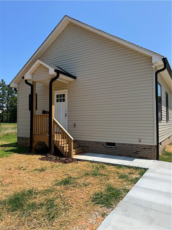 132 Koontz Avenue Lexington, NC 27295 - Photo 24 of 25 back of home. Covered back porch
