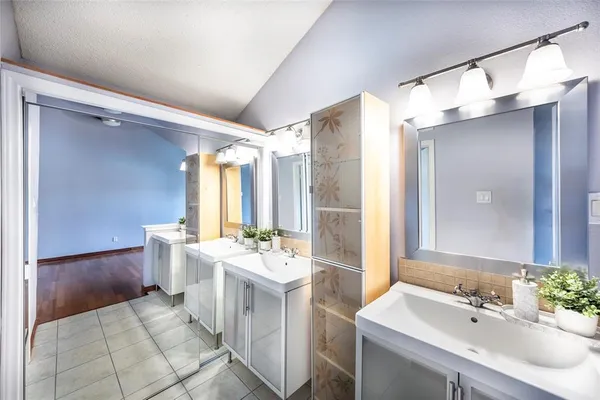 a white bath tub sitting next to a white toilet