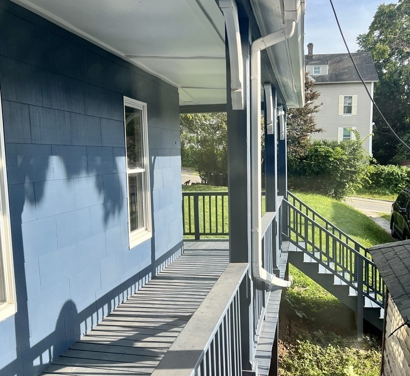 65 Prospect Street Worcester, MA 01605 - Photo 3 of 39 a view of a balcony with wooden floor