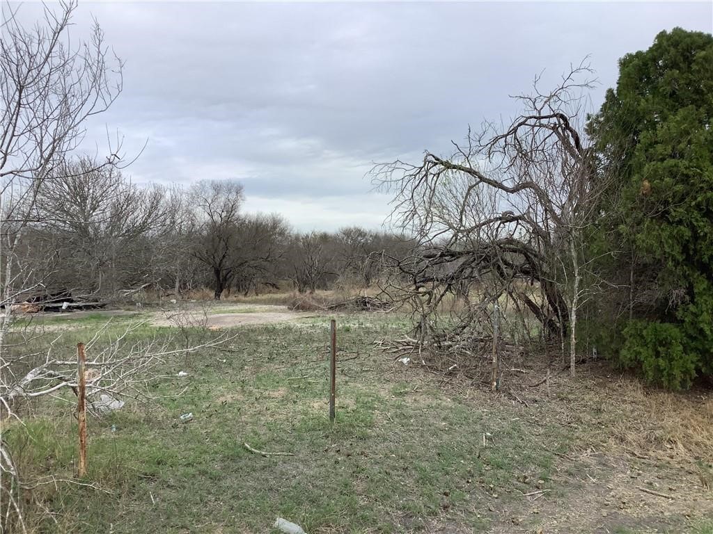 17 Chuckwagon Road Robstown, TX 78380 - Photo 2 of 3 a view of a field with trees in the background