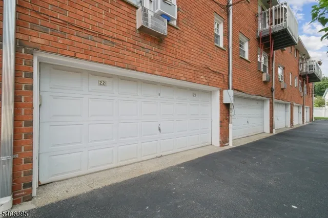 a view of a house with a parking space