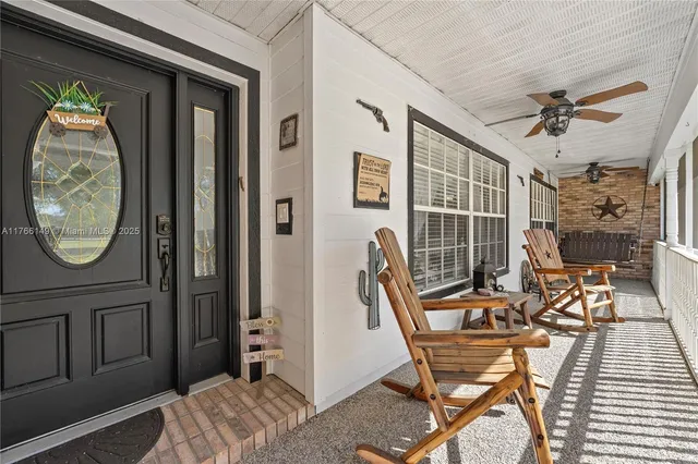 a kitchen with stainless steel appliances granite countertop a refrigerator a stove and a sink with cabinets