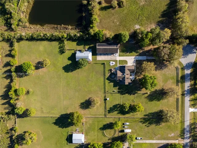 a front view of house with outdoor space and swimming pool