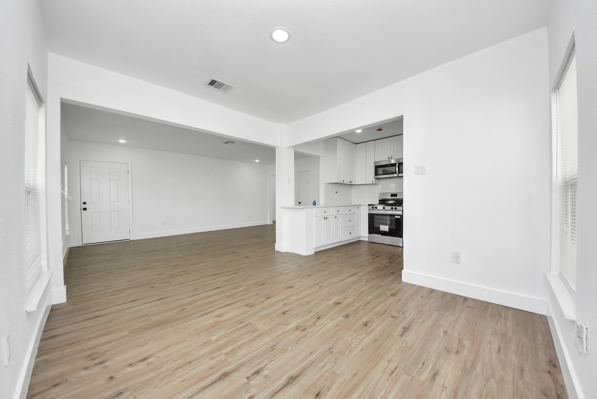 1203 West 6th Street Freeport, TX 77541 - Photo 14 of 50 a view of kitchen with wooden floor