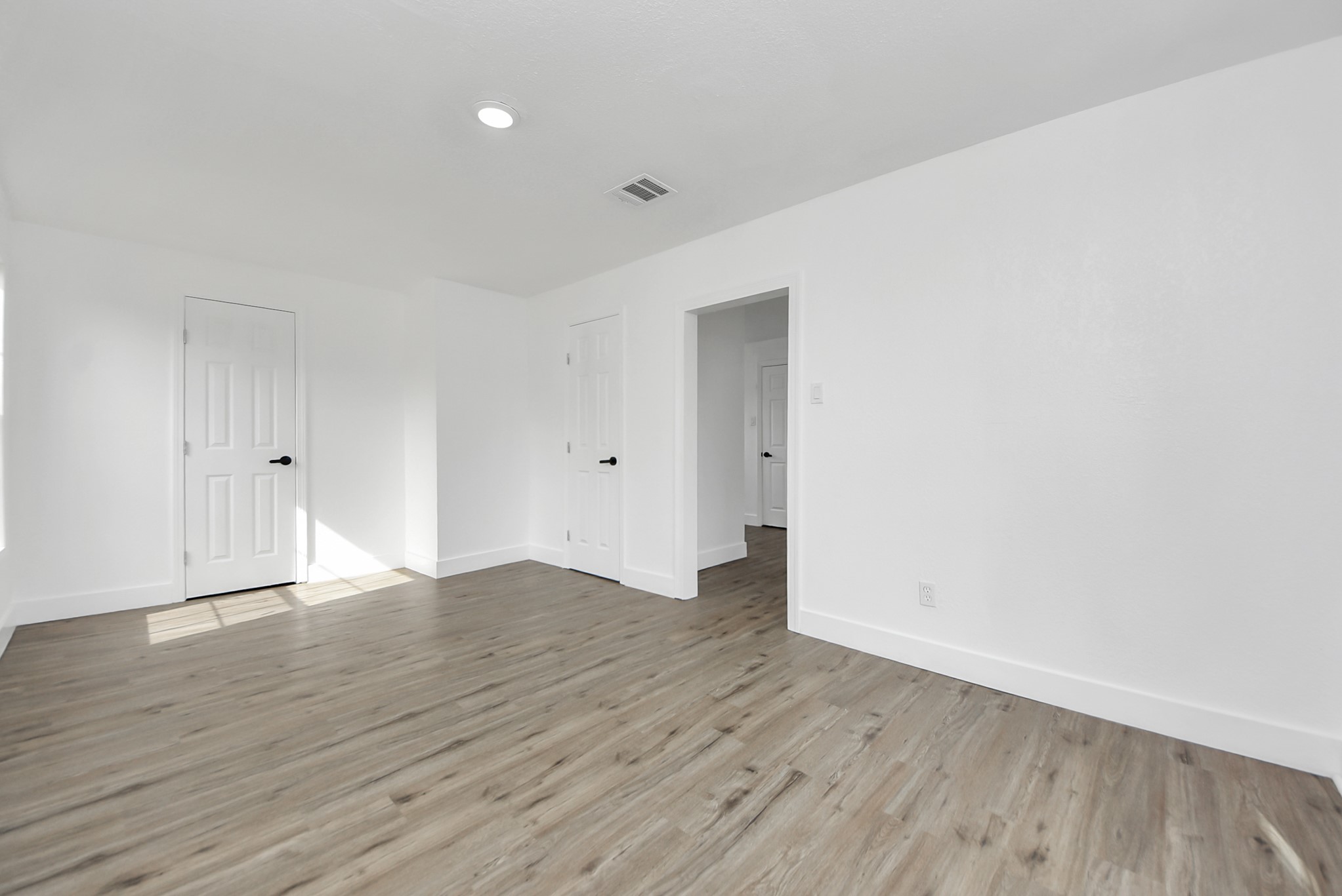1203 West 6th Street Freeport, TX 77541 - Photo 33 of 50 a view of an empty room with wooden floor
