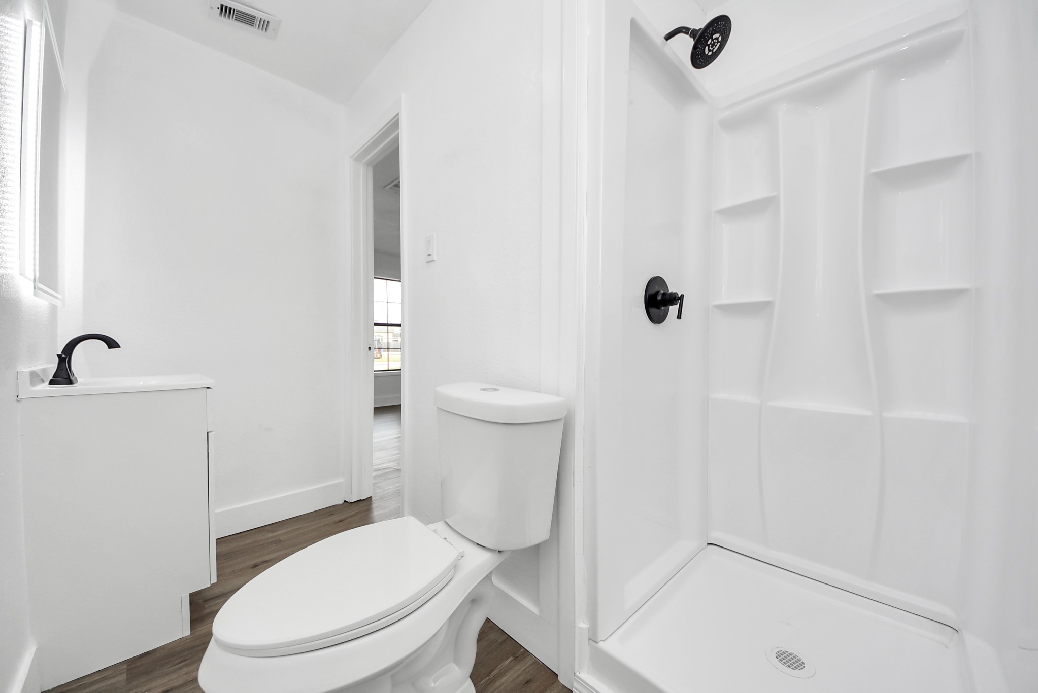 1203 West 6th Street Freeport, TX 77541 - Photo 37 of 50 a white toilet sitting next to a bath tub