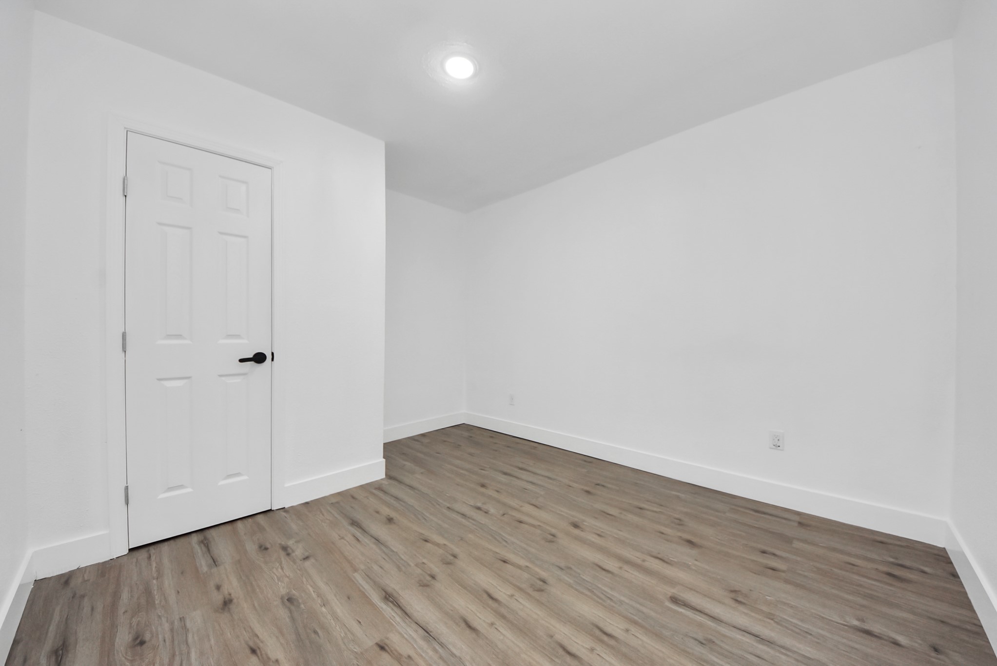 1203 West 6th Street Freeport, TX 77541 - Photo 38 of 50 a view of an empty room with wooden floor