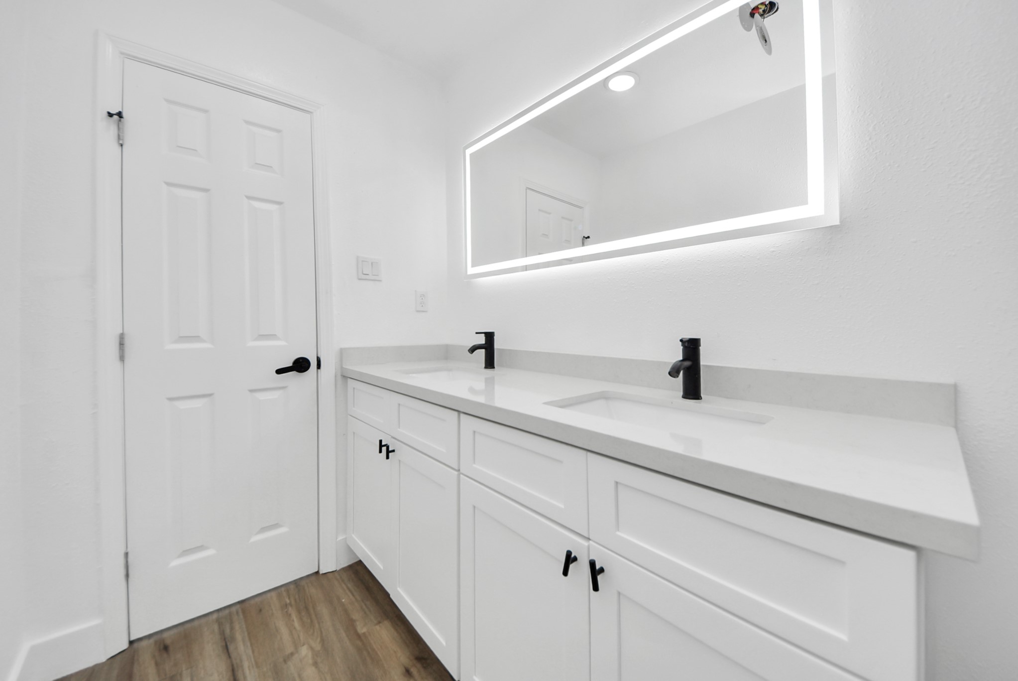 1203 West 6th Street Freeport, TX 77541 - Photo 41 of 50 a bathroom with a sink and mirror