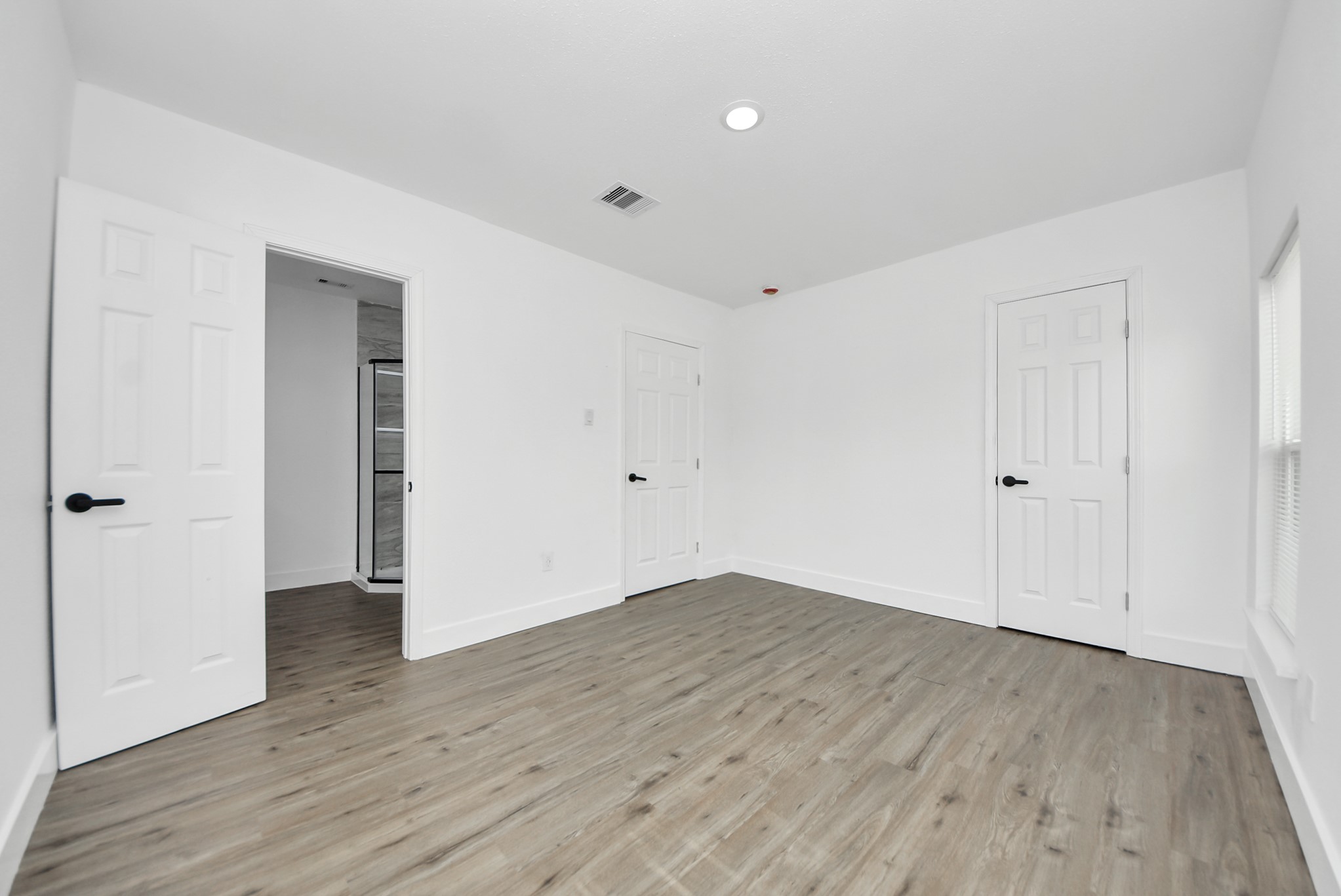 1203 West 6th Street Freeport, TX 77541 - Photo 45 of 50 a view of an empty room with wooden floor