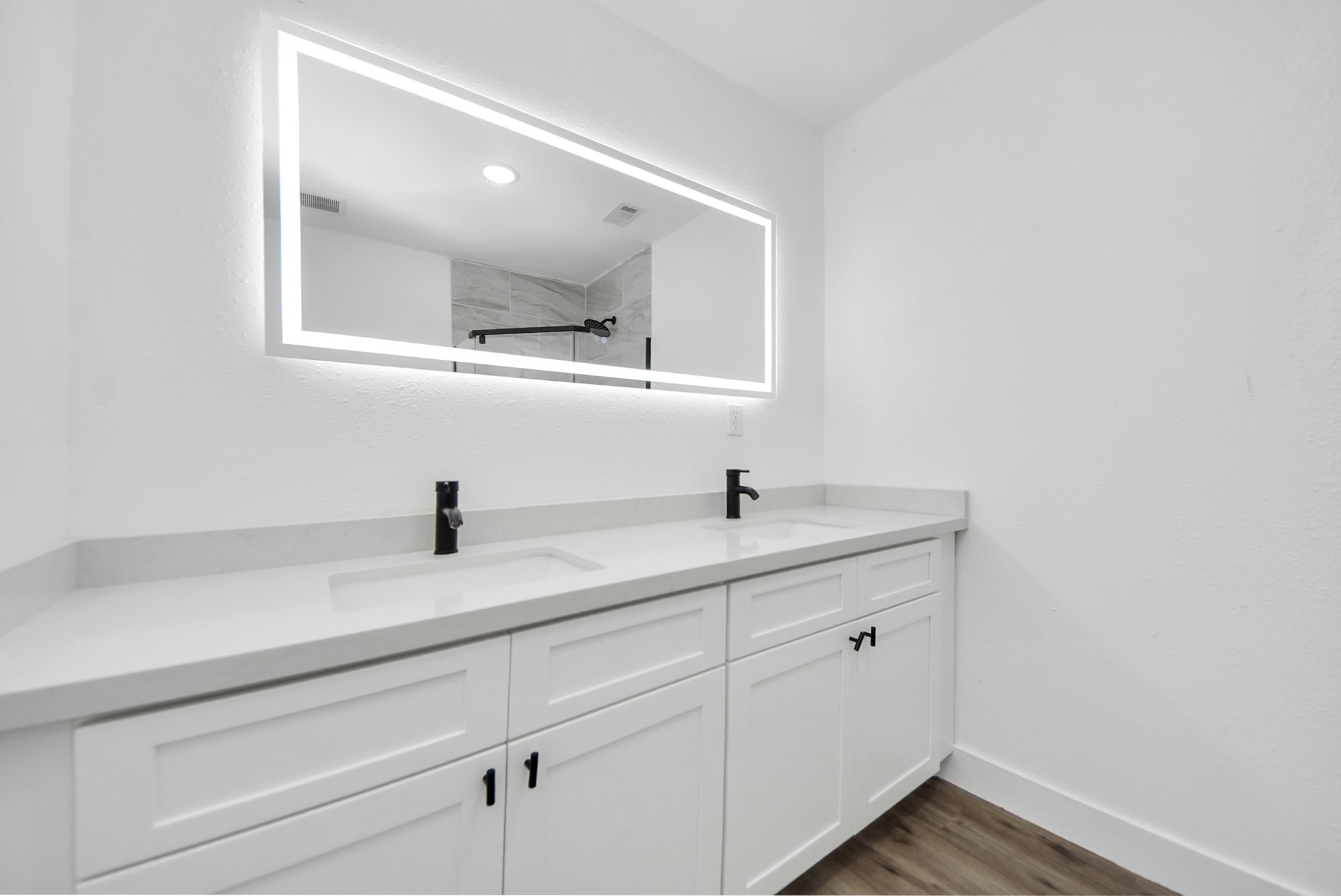 1203 West 6th Street Freeport, TX 77541 - Photo 48 of 50 a bathroom with a double vanity sink and mirror