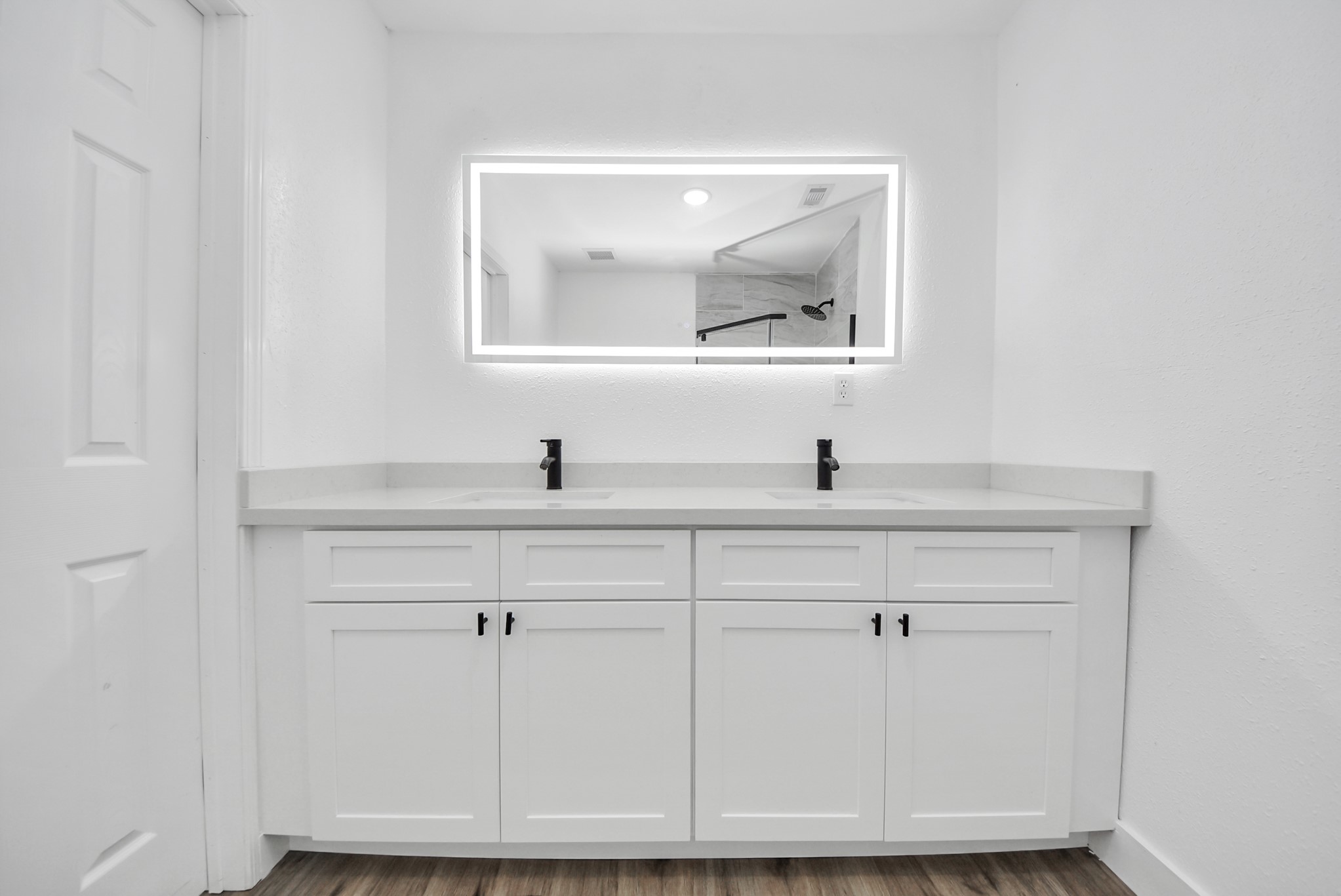 1203 West 6th Street Freeport, TX 77541 - Photo 49 of 50 a bathroom with a sink and a mirror