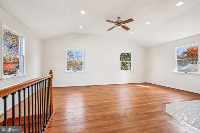 a view of livingroom with hardwood floor and a ceiling fan