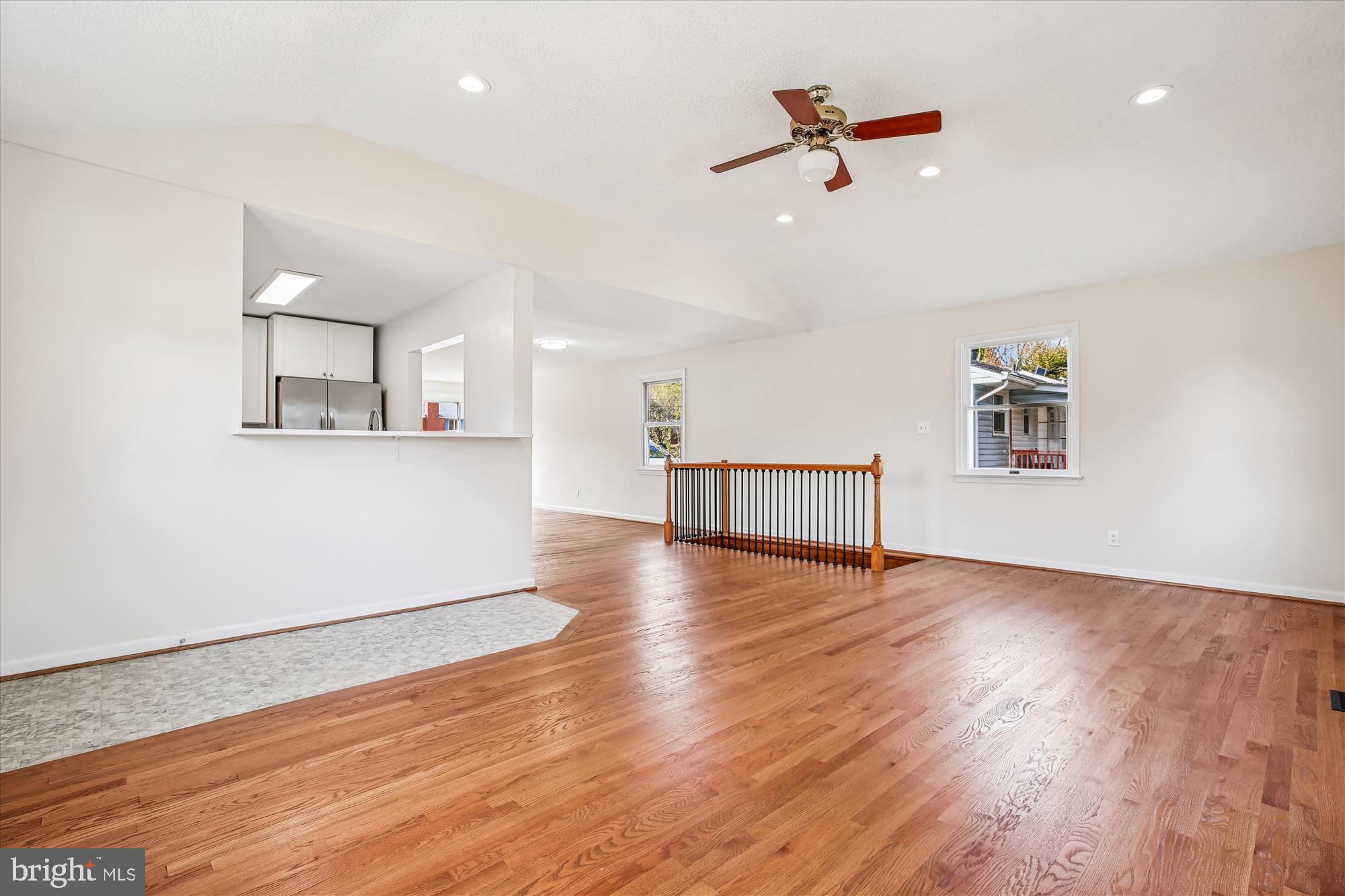 11603 Veirs Mill Road Silver Spring, MD 20902 - Photo 18 of 48 an empty room with wooden floor and windows