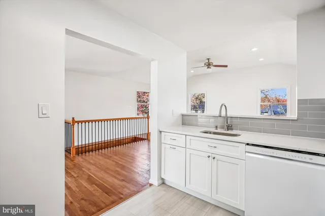 a en suite bathroom with a sink and mirror