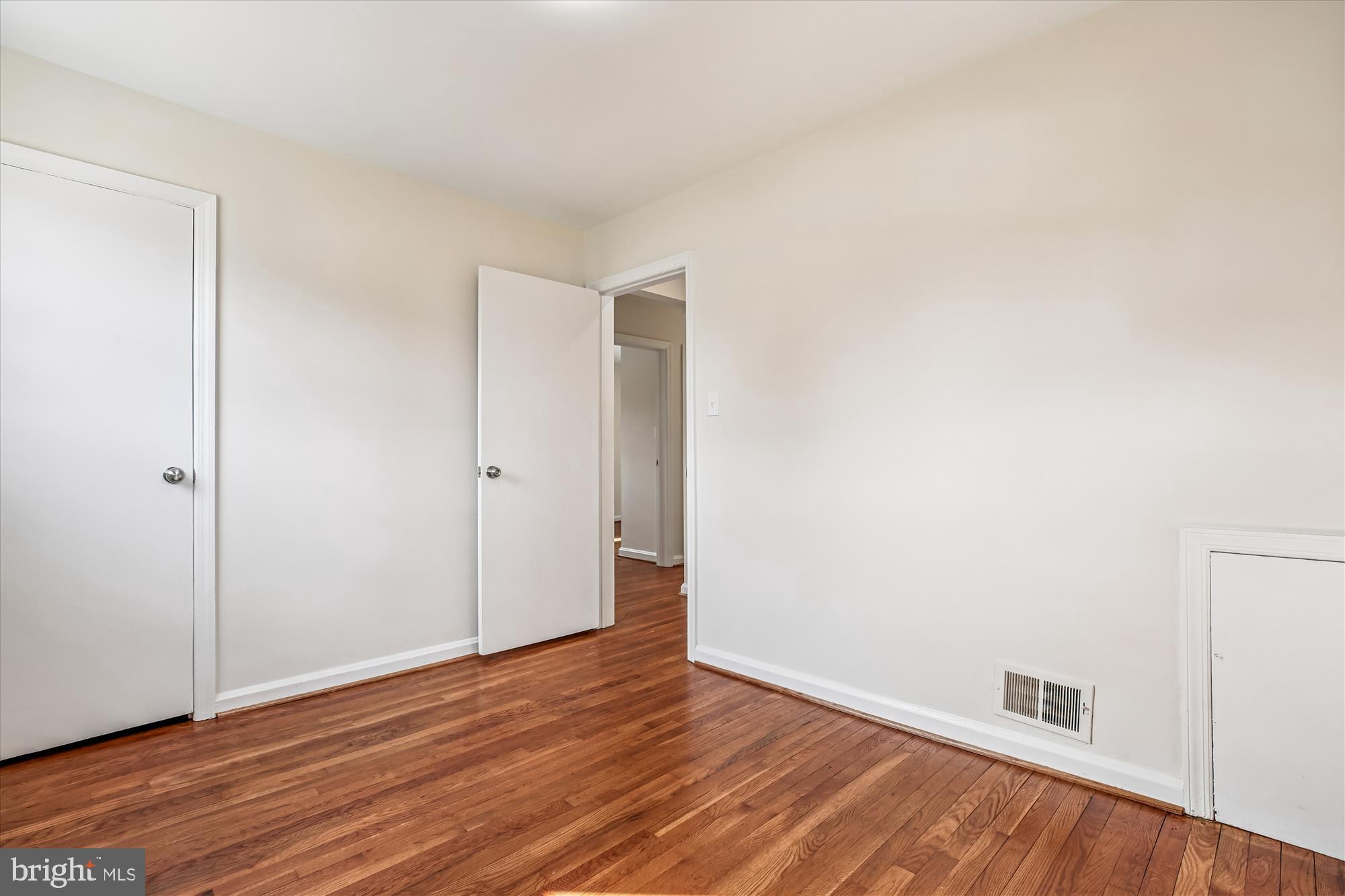11603 Veirs Mill Road Silver Spring, MD 20902 - Photo 28 of 48 a view of an empty room and wooden floor