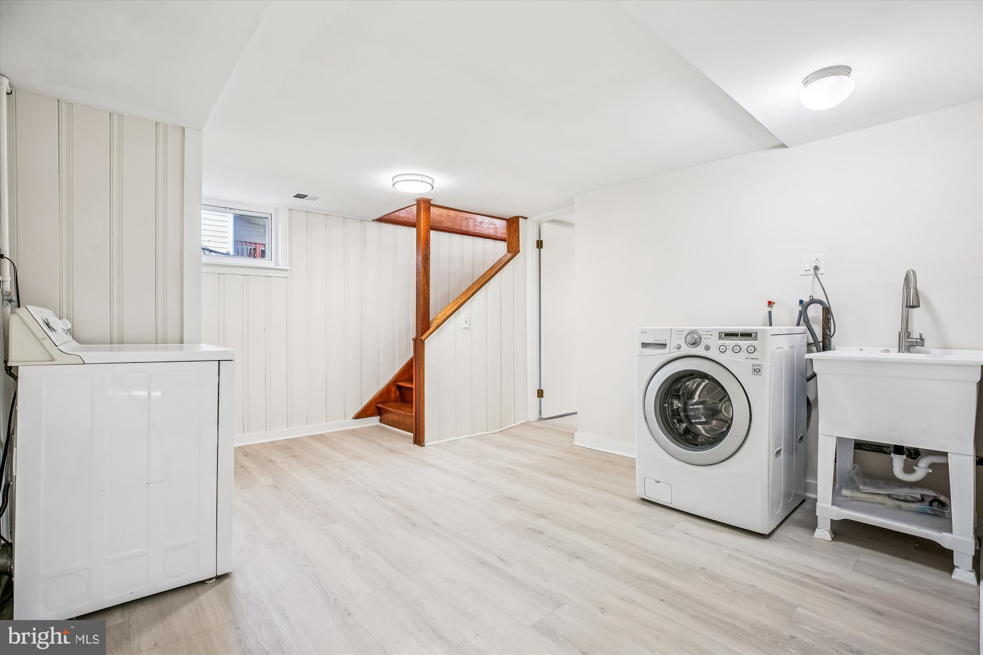 11603 Veirs Mill Road Silver Spring, MD 20902 - Photo 36 of 48 a view of a storage & utility room with washer and dryer