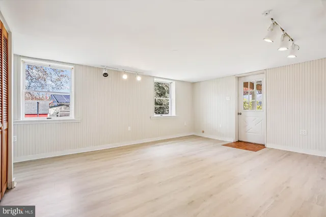 a view of an empty room with a window