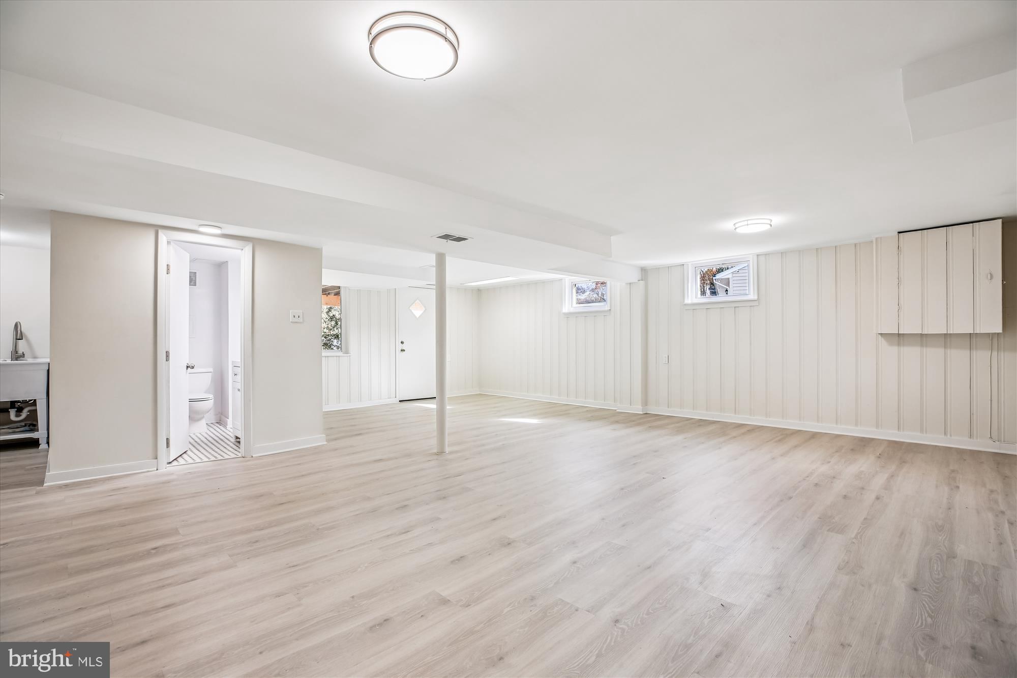 11603 Veirs Mill Road Silver Spring, MD 20902 - Photo 42 of 48 a view of an empty room with wooden floor