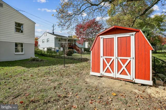 a view of a backyard with a barn