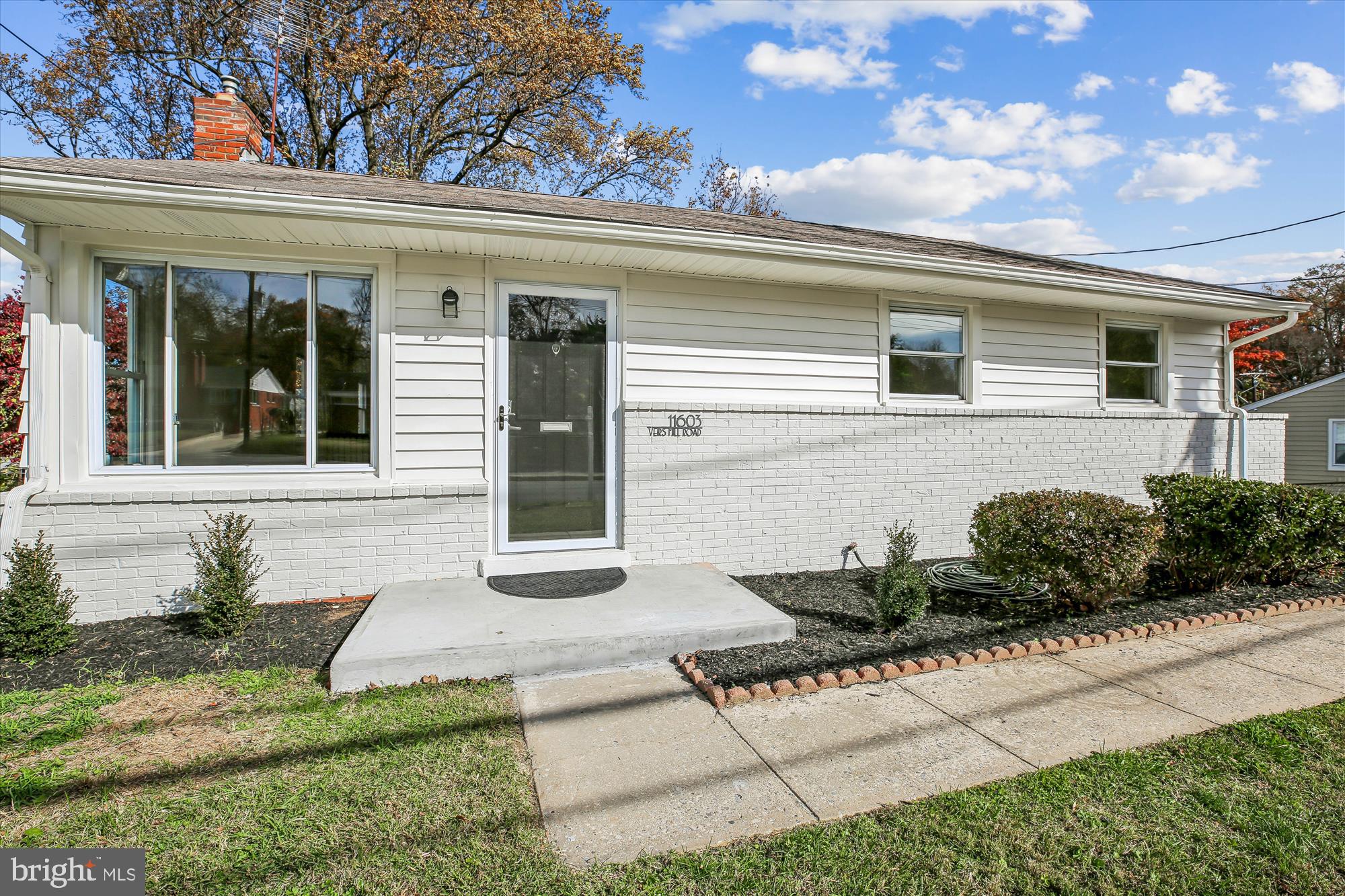 11603 Veirs Mill Road Silver Spring, MD 20902 - Photo 10 of 48 a front view of a house with a yard and potted plants