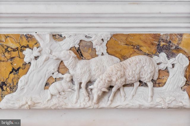 a view of a utility room with cabinet and entryway
