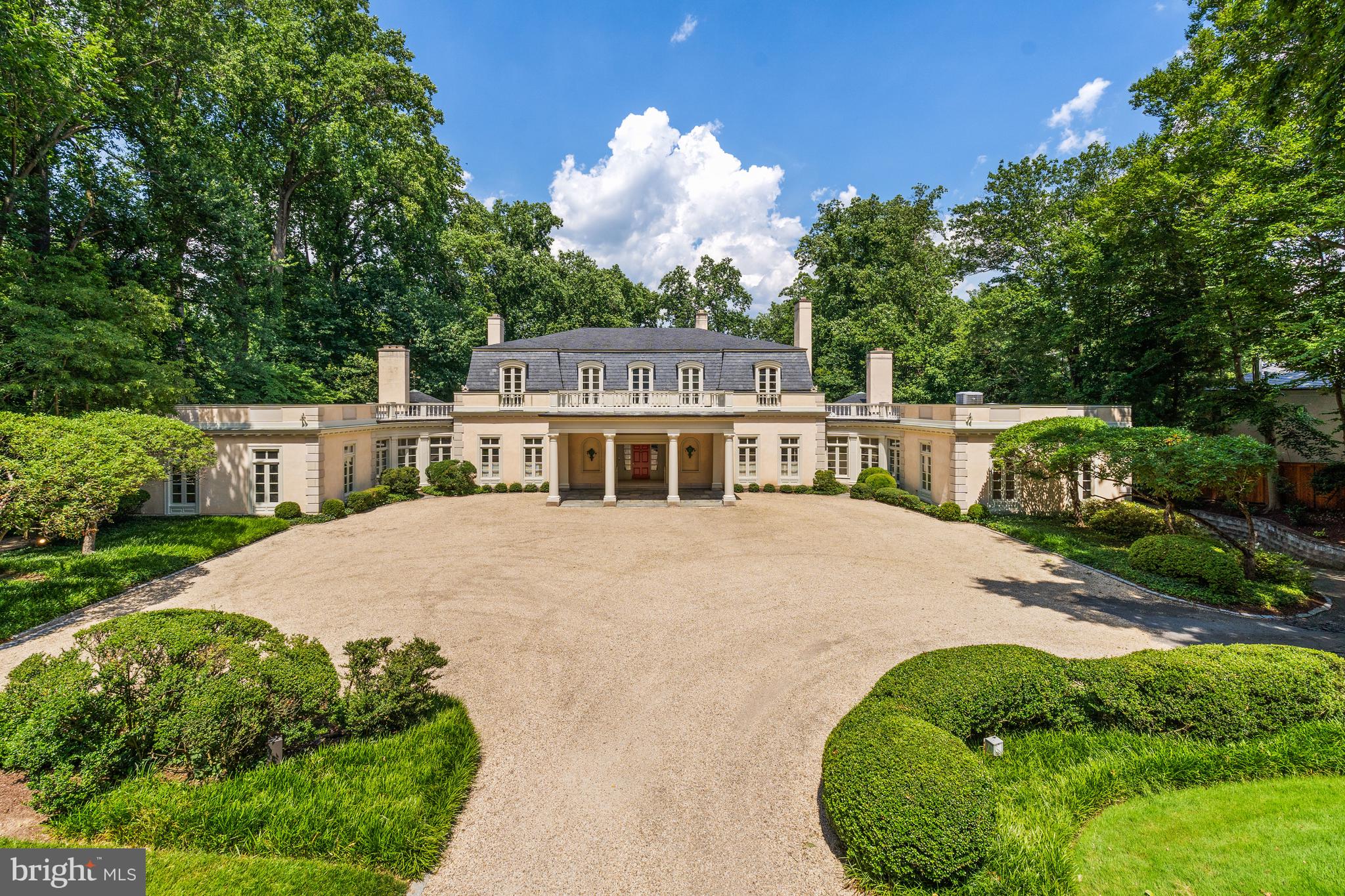 1260 Crest Lane McLean, VA 22101 - Photo 6 of 36 a front view of a house with a garden and trees