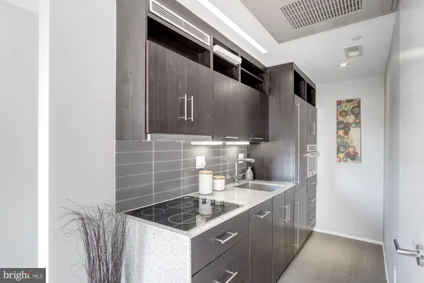 a kitchen that has a sink and a stove