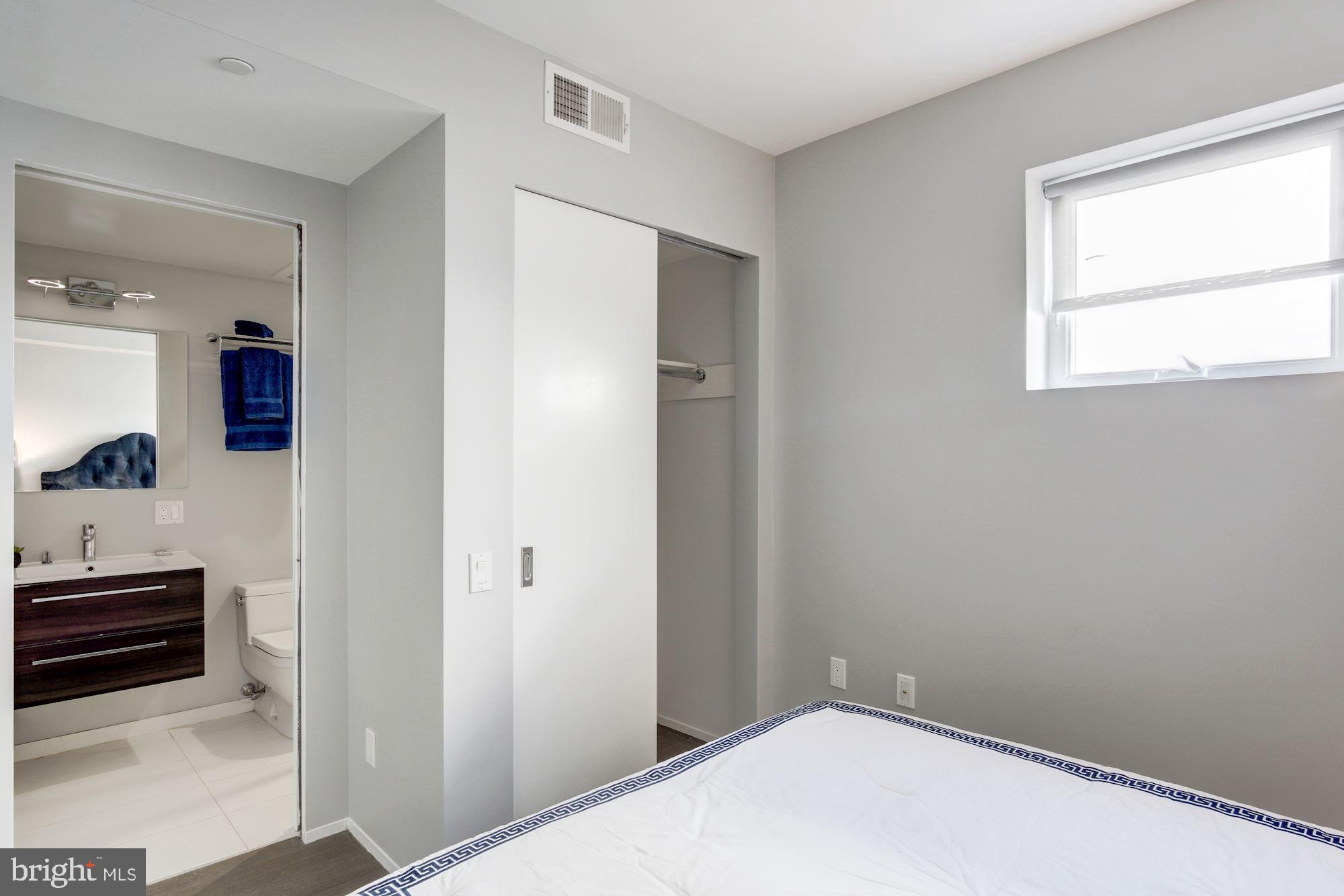 2422-2424 17th Street Northwest, Unit 301 Washington, DC 20009 - Photo 18 of 31 a bedroom with bed and window