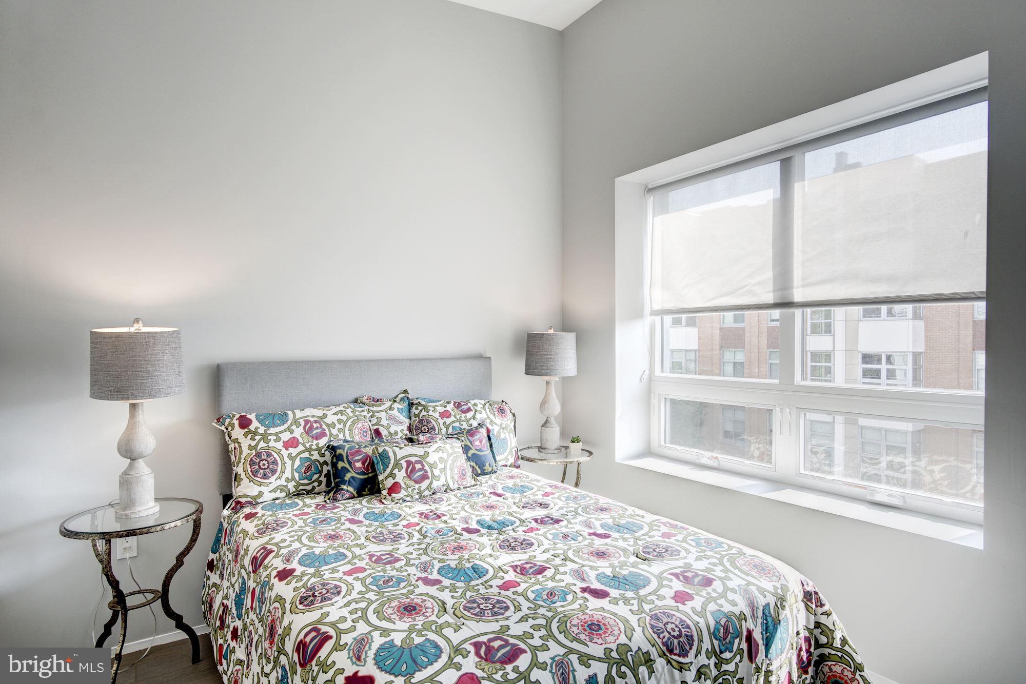 2422-2424 17th Street Northwest, Unit 301 Washington, DC 20009 - Photo 20 of 31 a bedroom with a bed and a window