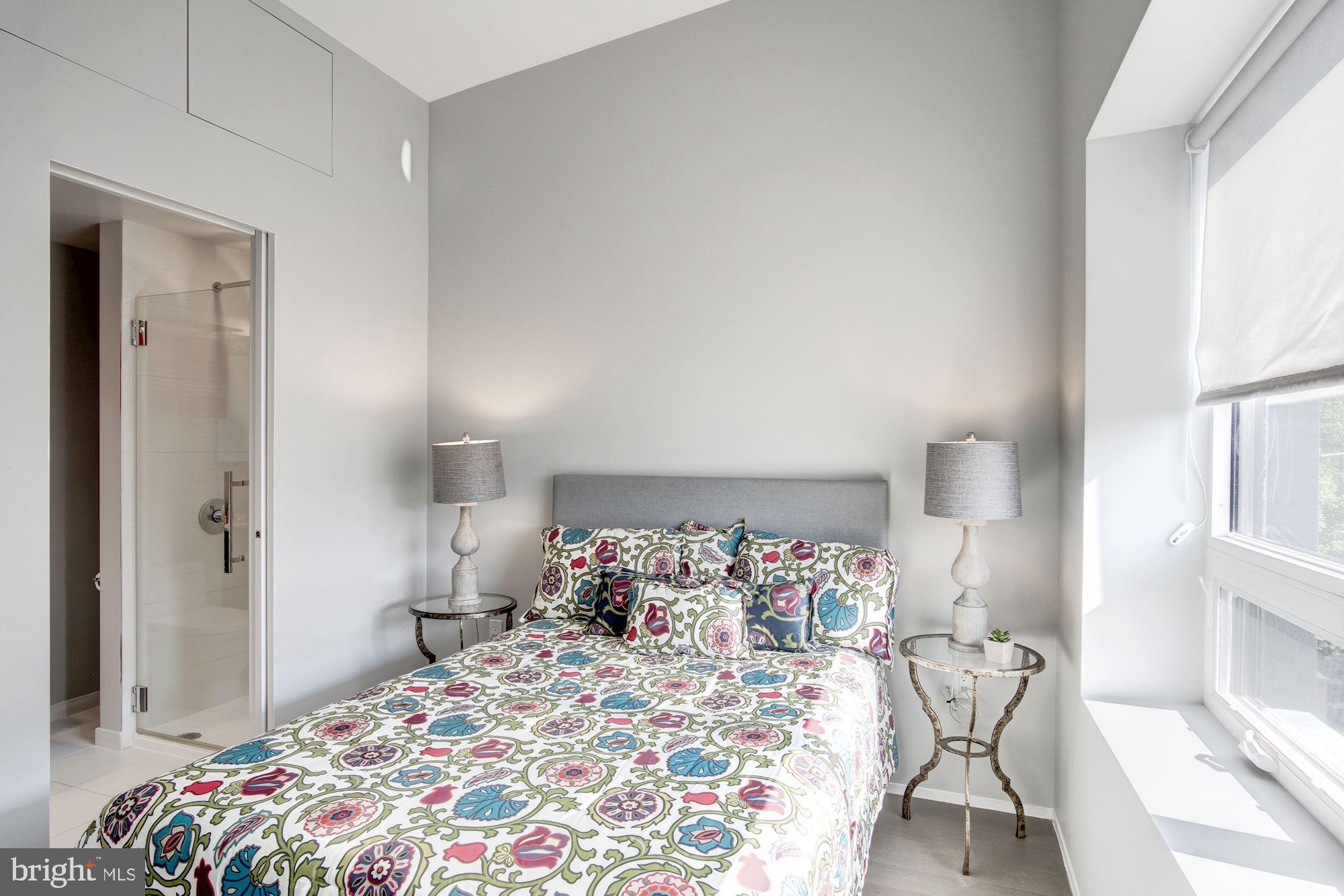 2422-2424 17th Street Northwest, Unit 301 Washington, DC 20009 - Photo 21 of 31 a bedroom with a bed and a window