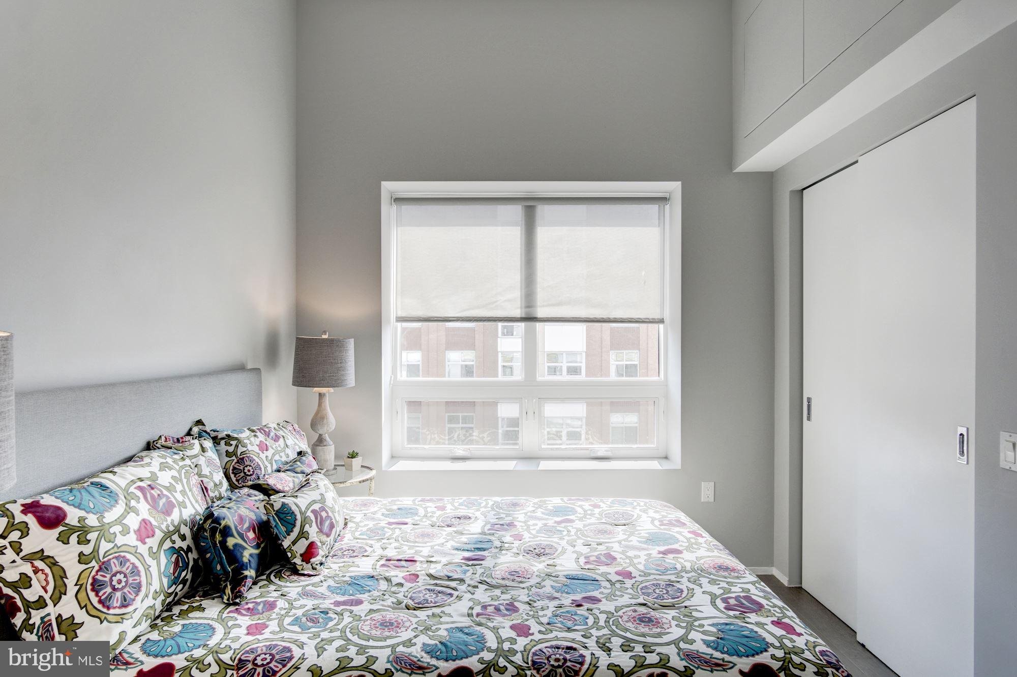 2422-2424 17th Street Northwest, Unit 301 Washington, DC 20009 - Photo 23 of 31 a bed room with a bed and a window