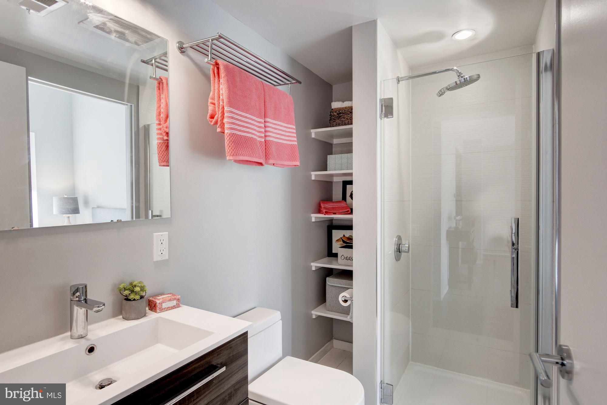 2422-2424 17th Street Northwest, Unit 301 Washington, DC 20009 - Photo 24 of 31 a bathroom with a sink toilet and shower