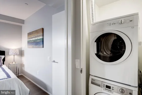 a view of a hallway with washer and dryer