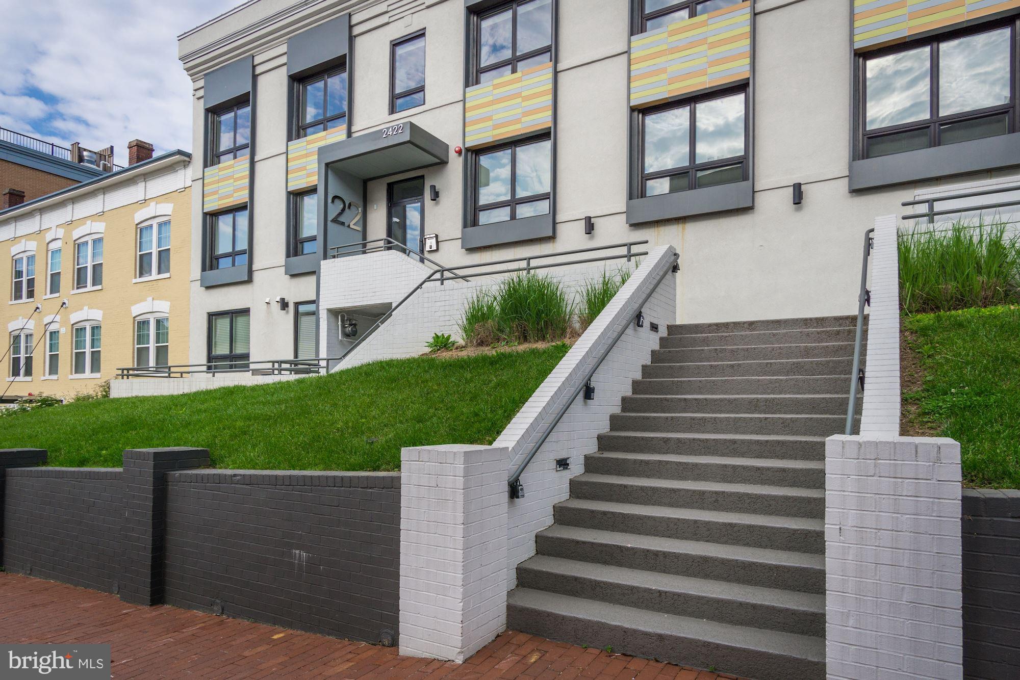 2422-2424 17th Street Northwest, Unit 301 Washington, DC 20009 - Photo 27 of 31 a view of a building with a yard