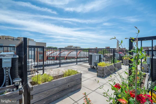 a view of a chairs and table in patio