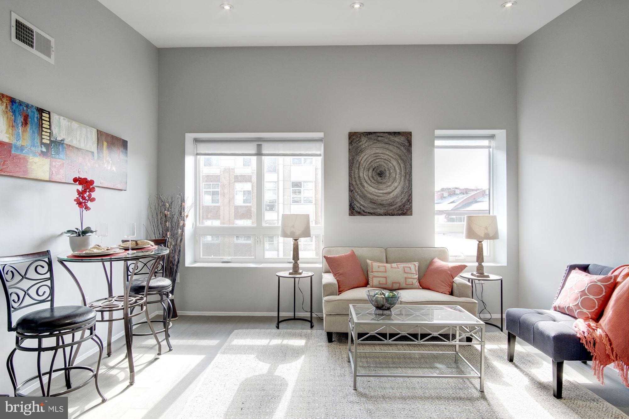 2422-2424 17th Street Northwest, Unit 301 Washington, DC 20009 - Photo 4 of 31 a living room with furniture and a window
