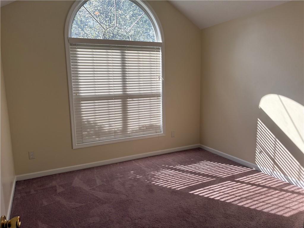 5975 Hillvale Trail Lithonia, GA 30058 - Photo 8 of 10 a view of an empty room with a window