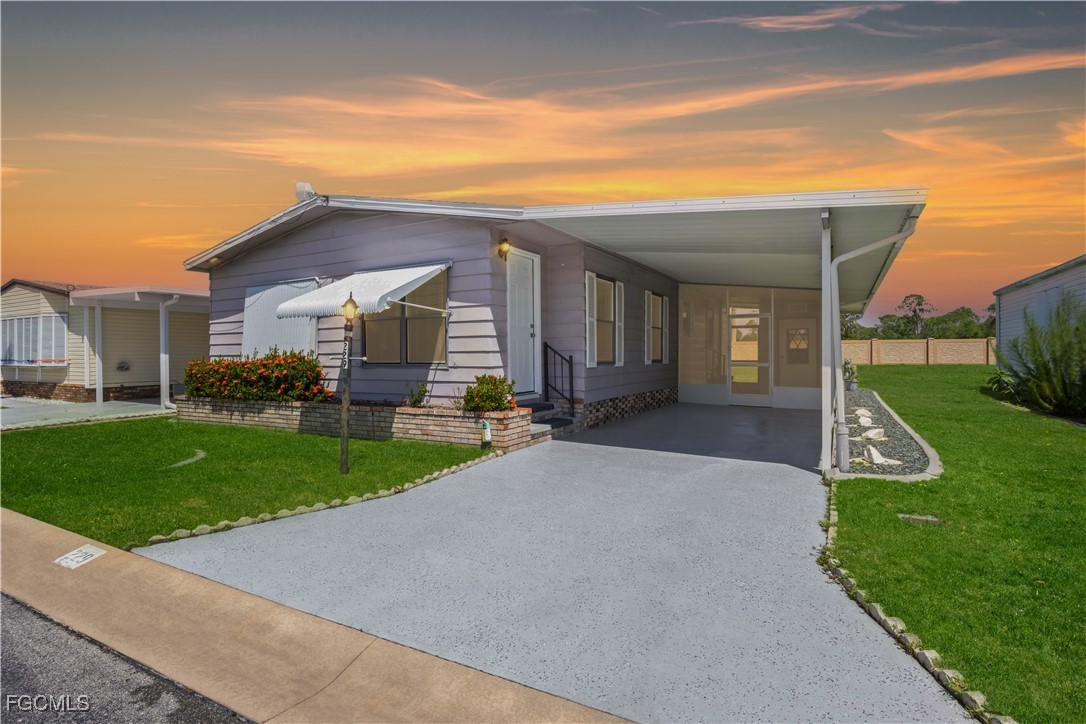 15550 Burnt Store Road, Unit 229 Punta Gorda, FL 33955 - Photo 1 of 41 a view of a house with backyard and porch