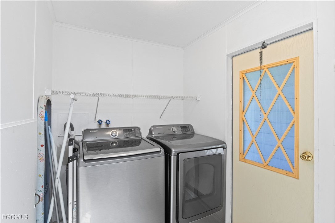 15550 Burnt Store Road, Unit 229 Punta Gorda, FL 33955 - Photo 22 of 41 a utility room with dryer and washer
